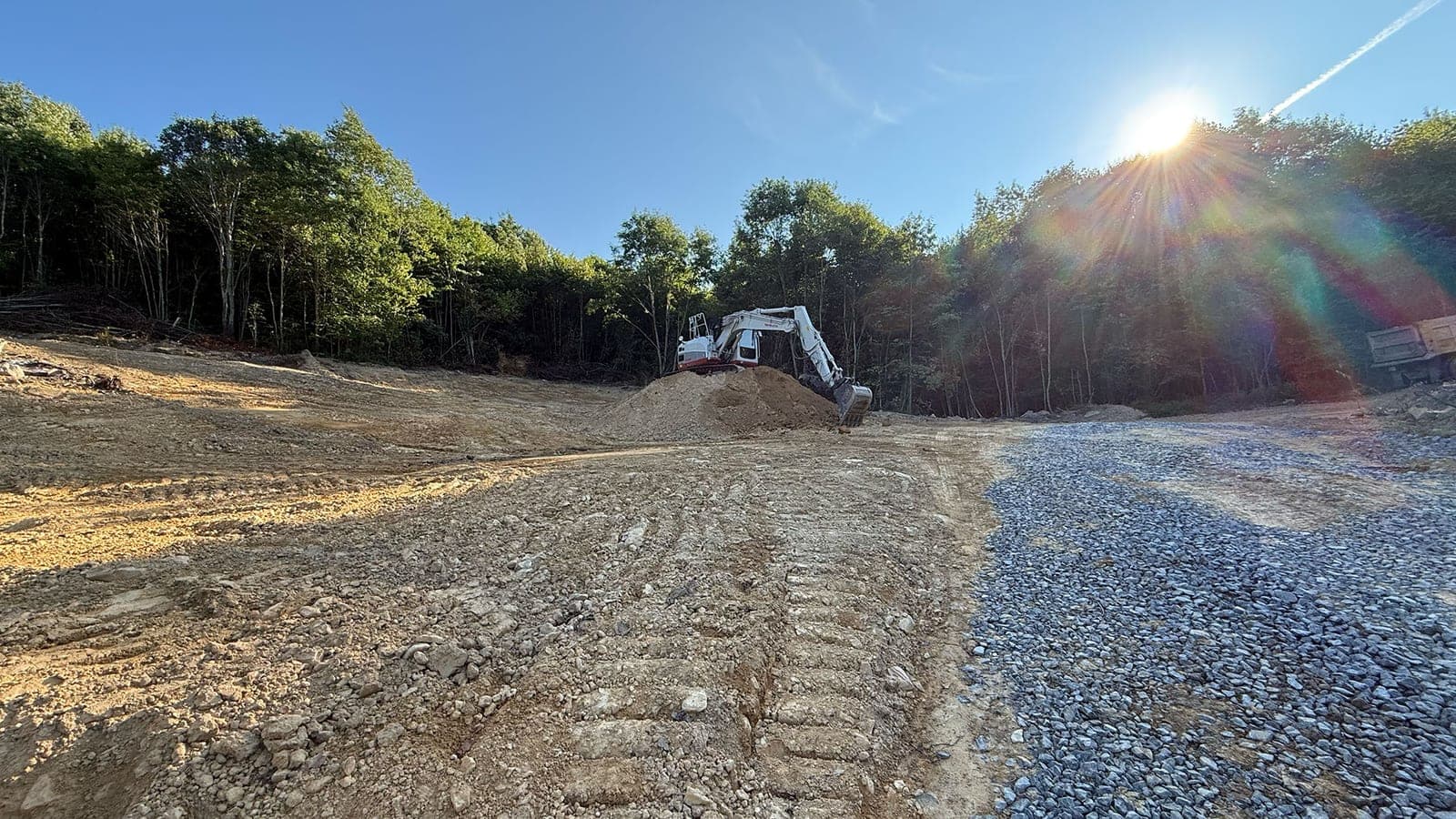 Cleared and graded building site with fresh gravel base, West Virginia